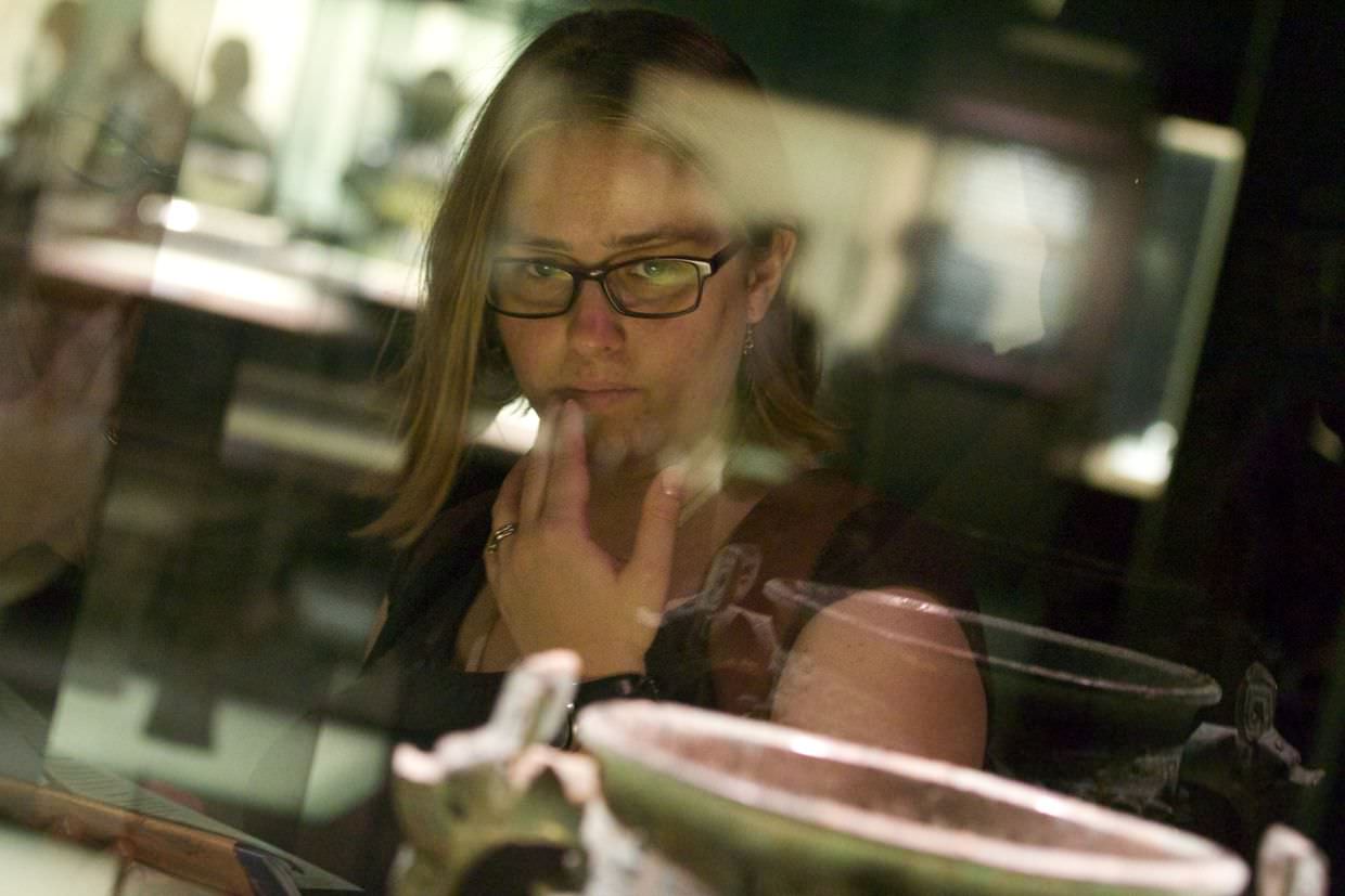 Samantha examining some of the bronzeware exhibits