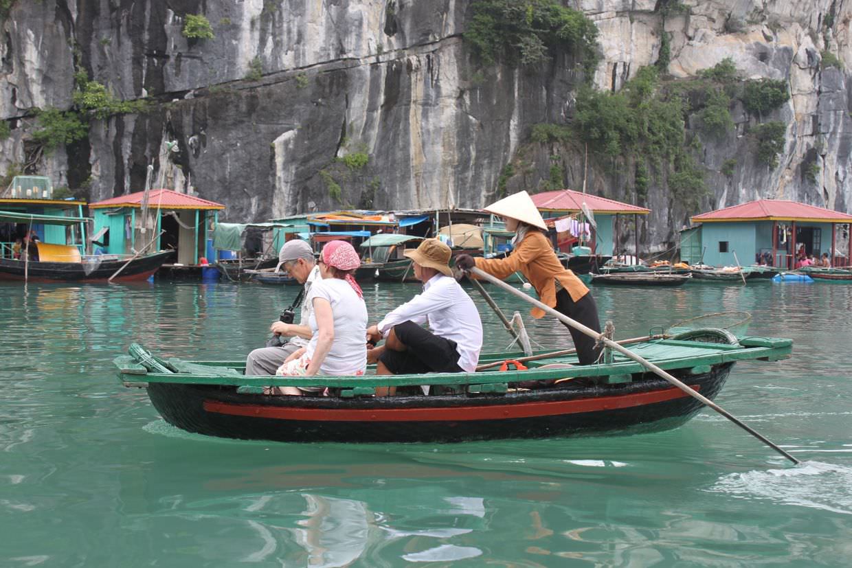 Exploring a fishing village by row boat