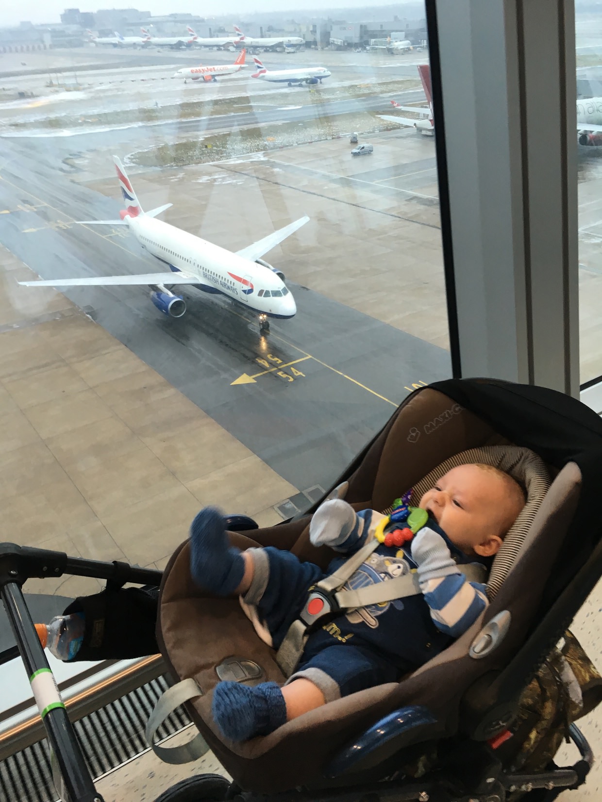 “We’re doing this!”, Conway about to board a plane at 3 months old