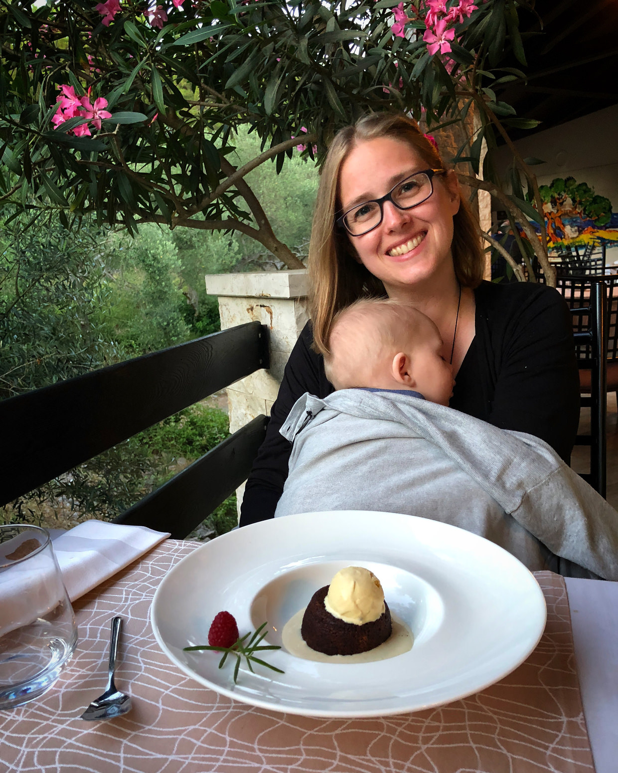 Samantha with soufflé and Conway asleep at Restaurant Rosemary