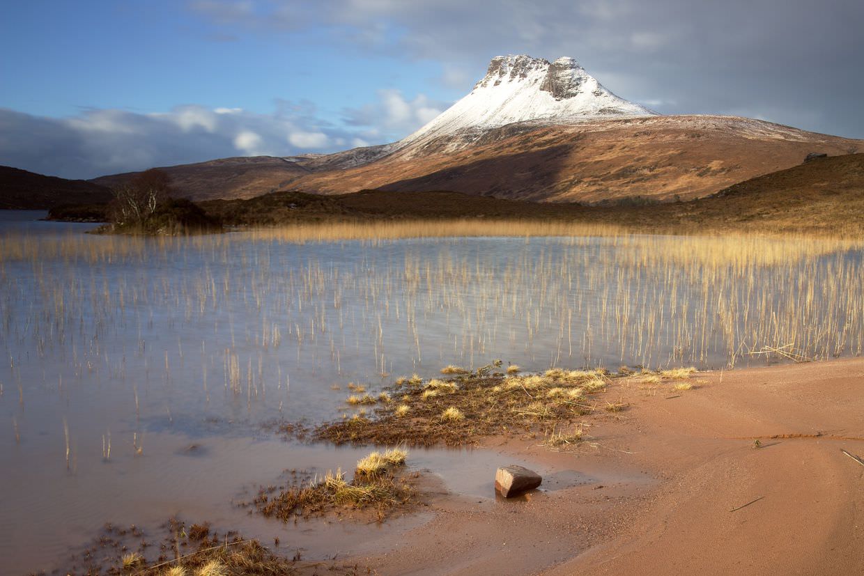 Stac Pollaidh with direct light on the mountain and reeds (longer exposure)