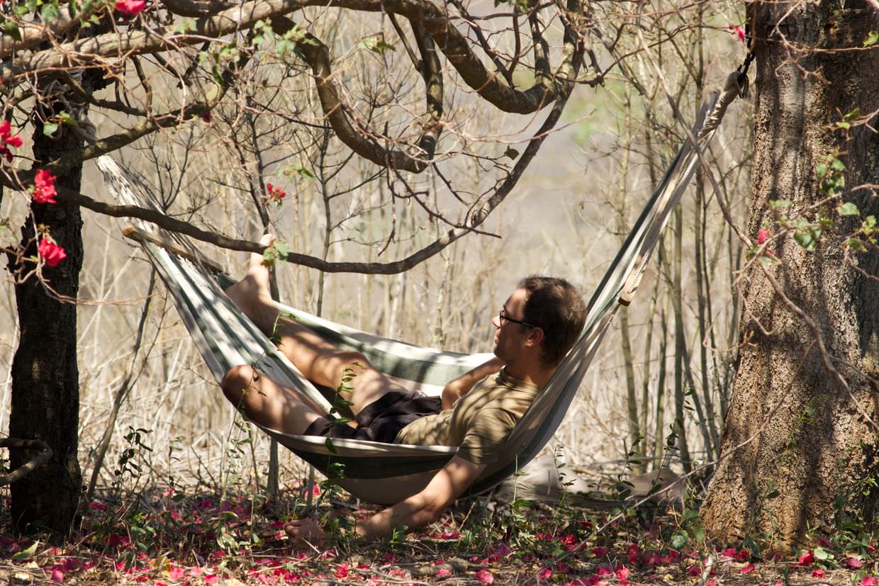 Paweł resting in the hammock at camp