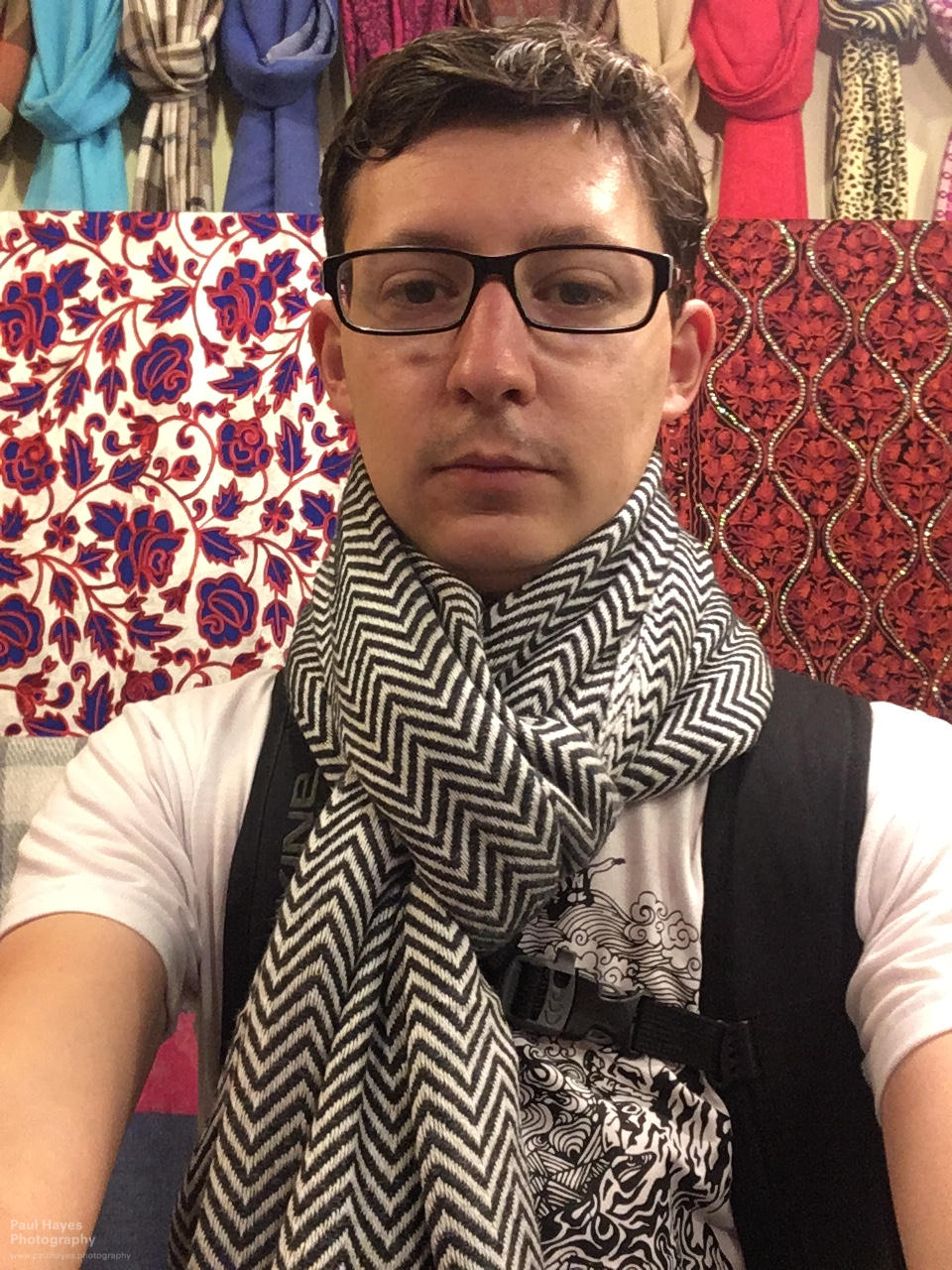 Paul trying on scarves